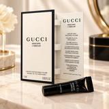 Gucci Mascara L'Obscur tube held in open booklet close up